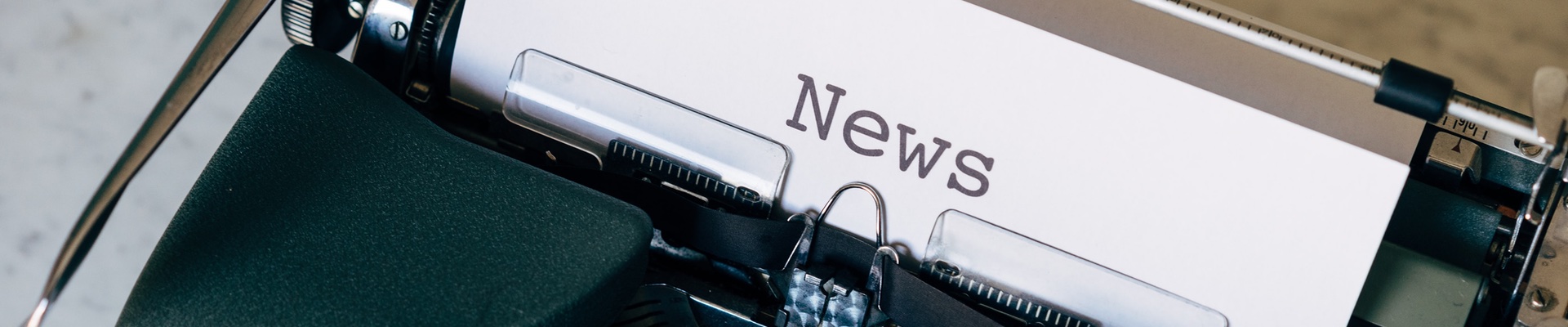 Typewriter with paper titled "News" inserted.
